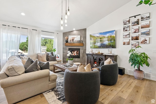 273 N 200 W Unit 1, Kamas, UT 84036 - living room with light wood-style flooring, a tile fireplace, and recessed lighting