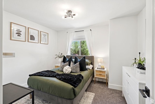 273 N 200 W Unit 1, Kamas, UT 84036 - bedroom with dark colored carpet and a chandelier