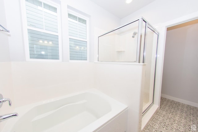 11511 S Pebble Pond Rd, South Jordan, UT 84009 - bathroom featuring a stall shower, a garden tub, and tile patterned floors