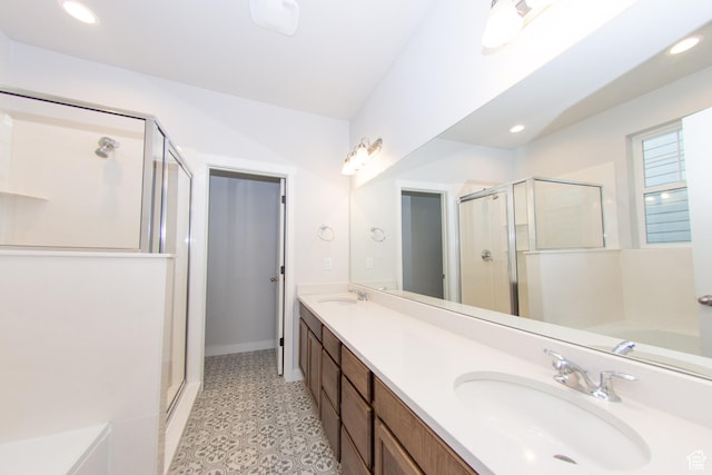 11511 S Pebble Pond Rd, South Jordan, UT 84009 - bathroom with a stall shower, double vanity, tile patterned floors, a bath, and recessed lighting