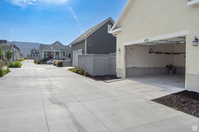 11511 S Pebble Pond Rd, South Jordan, UT 84009 - view of concrete driveway featuring a residential view