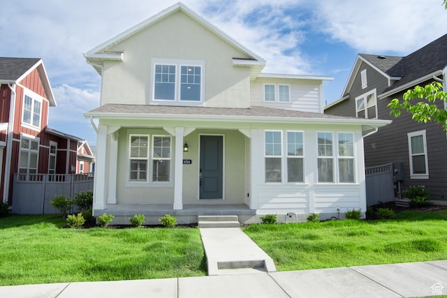 11511 S Pebble Pond Rd, South Jordan, UT 84009 - view of front of home with a porch, a front yard, and stucco siding