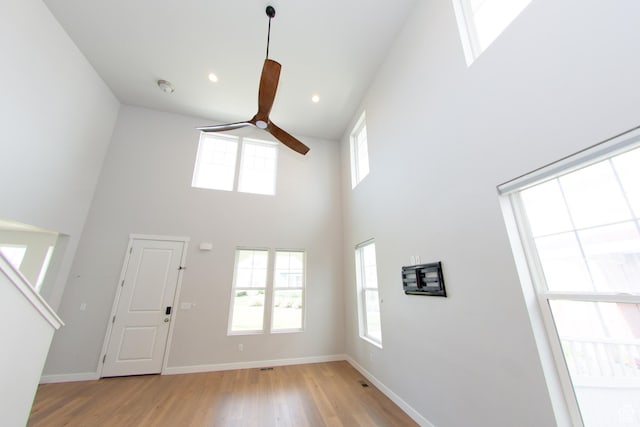11511 S Pebble Pond Rd, South Jordan, UT 84009 - foyer entrance with a ceiling fan, light wood-type flooring, a high ceiling, and recessed lighting