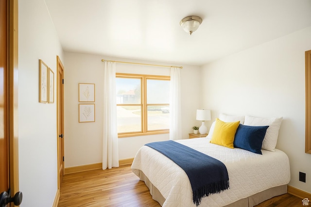 8646 W Florence Dr, Magna, UT 84044 - bedroom with light wood finished floors and baseboards