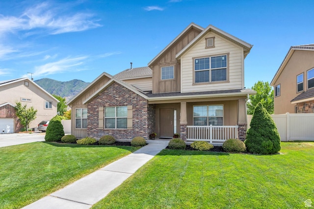 52 N 1100 W, Springville, UT 84663 - view of front of house with board and batten siding, covered porch, a mountain view, and brick siding