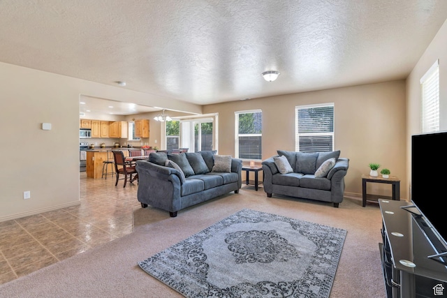 52 N 1100 W, Springville, UT 84663 - living area with healthy amount of natural light, light carpet, a chandelier, a textured ceiling, and light tile patterned flooring