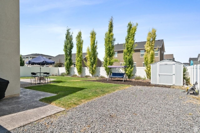 3634 S Creek Side Ln, Syracuse, UT 84075 - fenced backyard with a patio, a storage unit, and a residential view