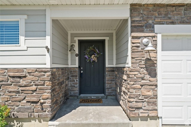 3634 S Creek Side Ln, Syracuse, UT 84075 - property entrance with stone siding and a garage