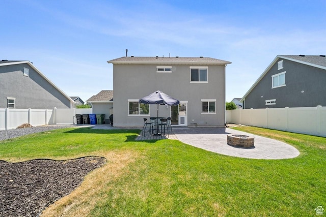 3634 S Creek Side Ln, Syracuse, UT 84075 - rear view of house featuring a fire pit, a patio area, a fenced backyard, and stucco siding