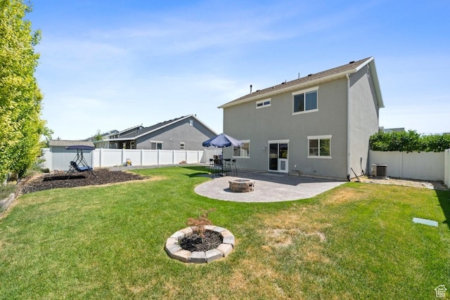 3634 S Creek Side Ln, Syracuse, UT 84075 - rear view of house featuring an outdoor fire pit, a patio, a fenced backyard, and stucco siding