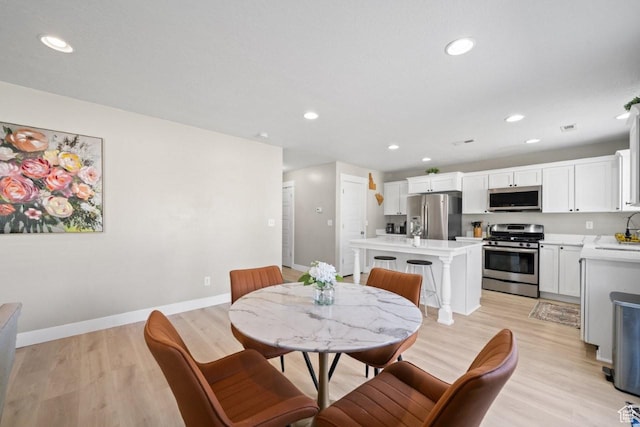 3634 S Creek Side Ln, Syracuse, UT 84075 - dining area with light wood-type flooring and recessed lighting