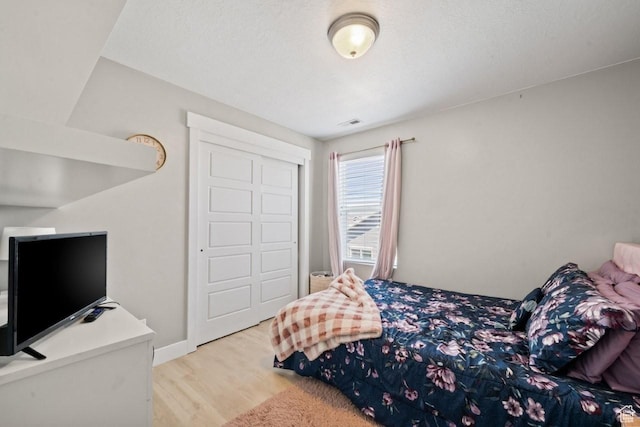 3634 S Creek Side Ln, Syracuse, UT 84075 - bedroom featuring wood finished floors and a closet