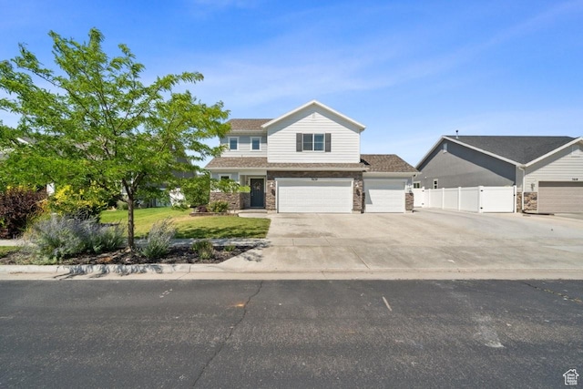 3634 S Creek Side Ln, Syracuse, UT 84075 - view of front of house with driveway, a garage, and brick siding