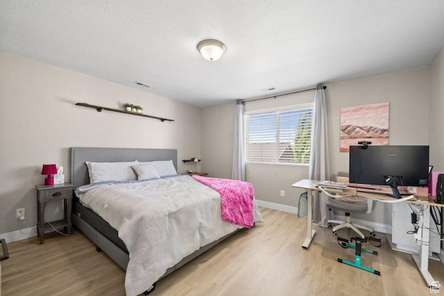 3634 S Creek Side Ln, Syracuse, UT 84075 - bedroom with light wood-type flooring and an office area