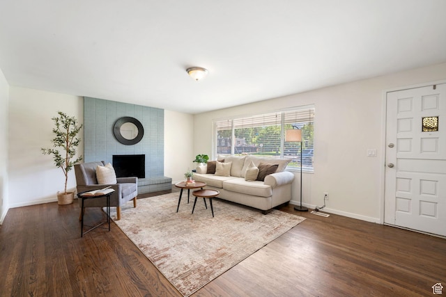 5726 S Highland Dr E, Holladay, UT 84121 - living area with dark wood-style flooring and a fireplace