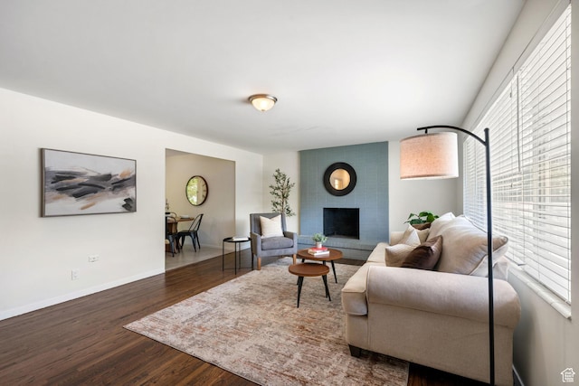5726 S Highland Dr E, Holladay, UT 84121 - living area featuring a brick fireplace and wood finished floors