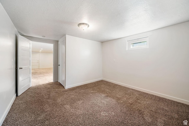 5726 S Highland Dr E, Holladay, UT 84121 - empty room with carpet flooring and a textured ceiling