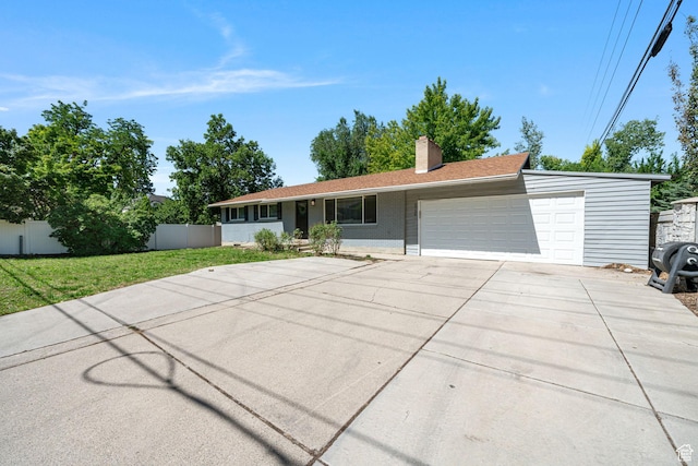 5726 S Highland Dr E, Holladay, UT 84121 - single story home featuring a garage, concrete driveway, and a chimney