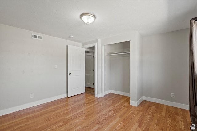 224 E 1950 S, Clearfield, UT 84015 - unfurnished bedroom with light wood finished floors and a closet
