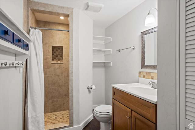 224 E 1950 S, Clearfield, UT 84015 - bathroom featuring vanity, a tile shower, and wood finished floors