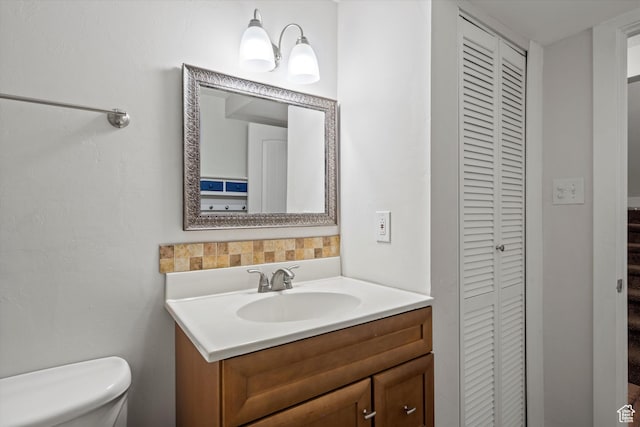 224 E 1950 S, Clearfield, UT 84015 - bathroom featuring a closet, vanity, and decorative backsplash