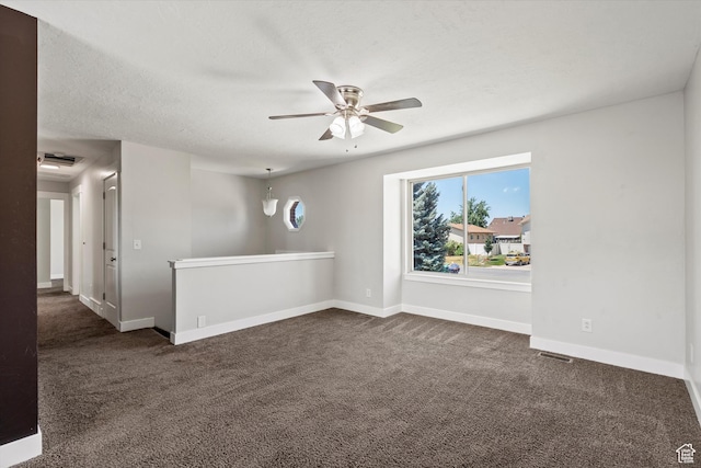 224 E 1950 S, Clearfield, UT 84015 - spare room featuring a ceiling fan and dark colored carpet