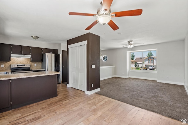 224 E 1950 S, Clearfield, UT 84015 - kitchen with appliances with stainless steel finishes, a ceiling fan, under cabinet range hood, tasteful backsplash, and dark brown cabinetry