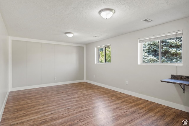 224 E 1950 S, Clearfield, UT 84015 - unfurnished room featuring a textured ceiling and wood finished floors