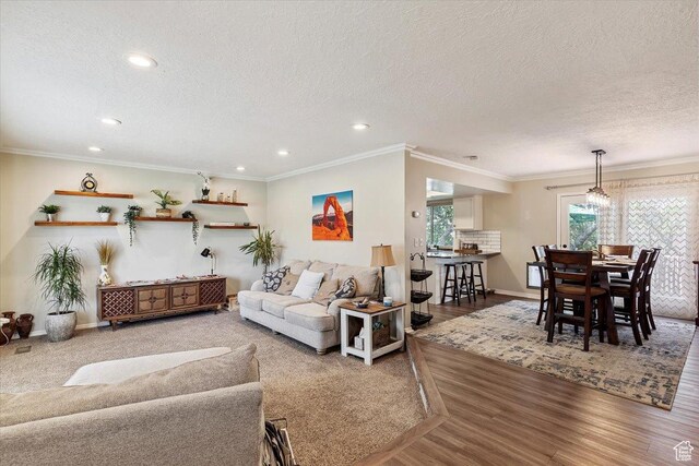 2772 E 3575 N, Layton, UT 84040 - living room featuring a textured ceiling, recessed lighting, wood finished floors, and ornamental molding