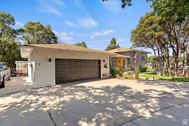2772 E 3575 N, Layton, UT 84040 - split level home with brick siding, driveway, and a garage