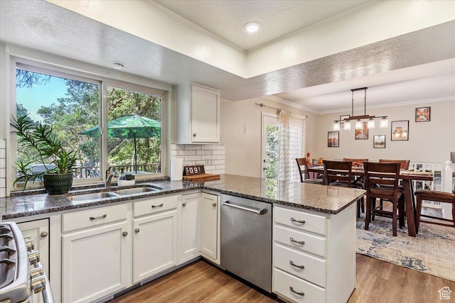 2772 E 3575 N, Layton, UT 84040 - kitchen featuring stainless steel dishwasher, a peninsula, light wood-style floors, white cabinets, and tasteful backsplash