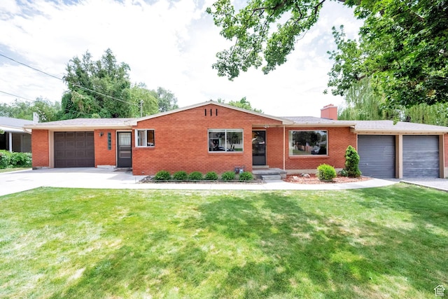 640 E 300 N, Pleasant Grove, UT 84062 - single story home featuring a garage, concrete driveway, brick siding, a chimney, and a front lawn