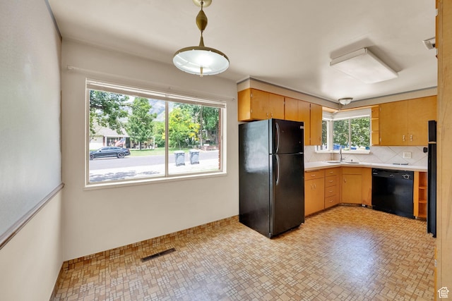 640 E 300 N, Pleasant Grove, UT 84062 - kitchen with black appliances, light countertops, decorative backsplash, and hanging light fixtures