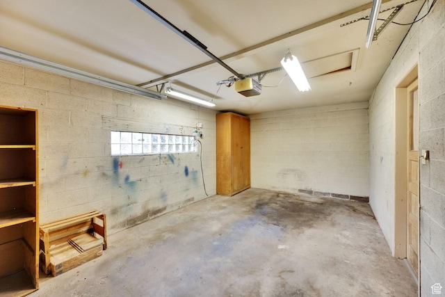 640 E 300 N, Pleasant Grove, UT 84062 - garage featuring a garage door opener and concrete block wall