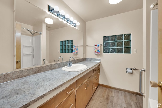 640 E 300 N, Pleasant Grove, UT 84062 - bathroom featuring wood finished floors, vanity, and a shower