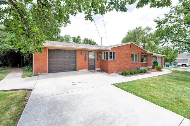 640 E 300 N, Pleasant Grove, UT 84062 - ranch-style house featuring brick siding, a garage, driveway, and a front yard
