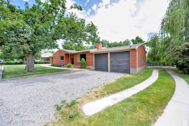 640 E 300 N, Pleasant Grove, UT 84062 - single story home with a chimney, brick siding, a garage, and driveway