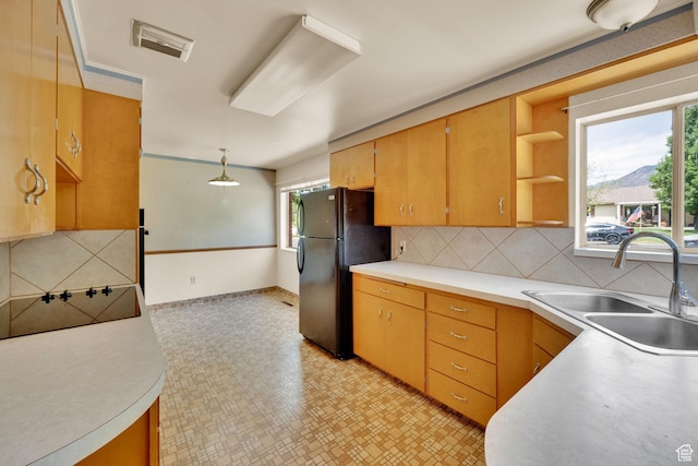 640 E 300 N, Pleasant Grove, UT 84062 - kitchen with black appliances, light countertops, tasteful backsplash, light flooring, and open shelves