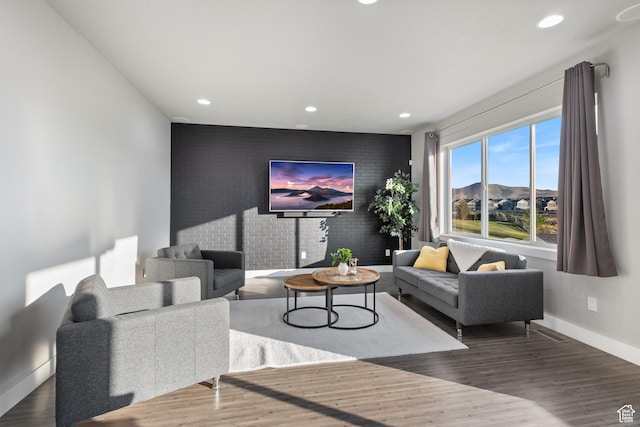7672 N Evans Ranch Dr E, Eagle Mountain, UT 84005 - living area with an accent wall, recessed lighting, and wood finished floors