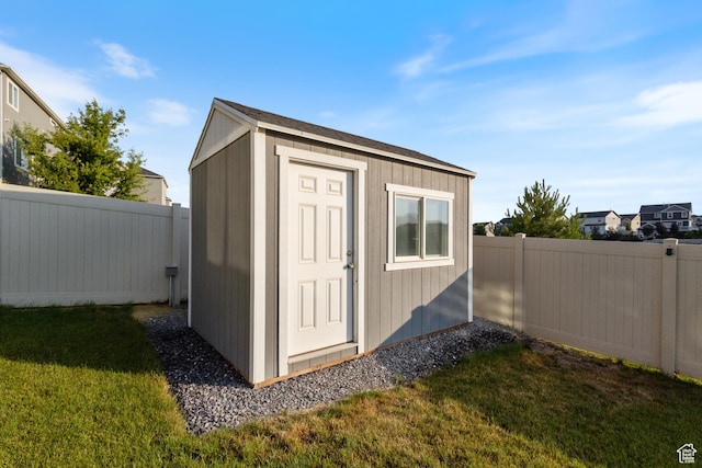 7672 N Evans Ranch Dr E, Eagle Mountain, UT 84005 - view of shed with a fenced backyard
