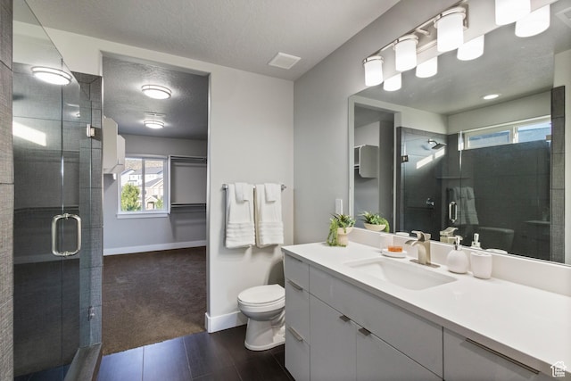7672 N Evans Ranch Dr E, Eagle Mountain, UT 84005 - bathroom featuring vanity, a textured ceiling, and a stall shower