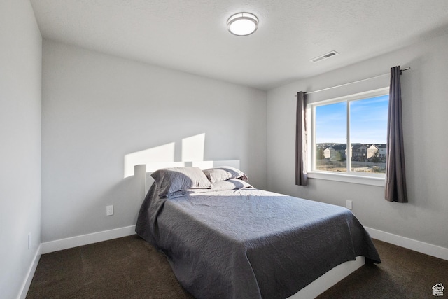 7672 N Evans Ranch Dr E, Eagle Mountain, UT 84005 - bedroom featuring dark colored carpet and baseboards