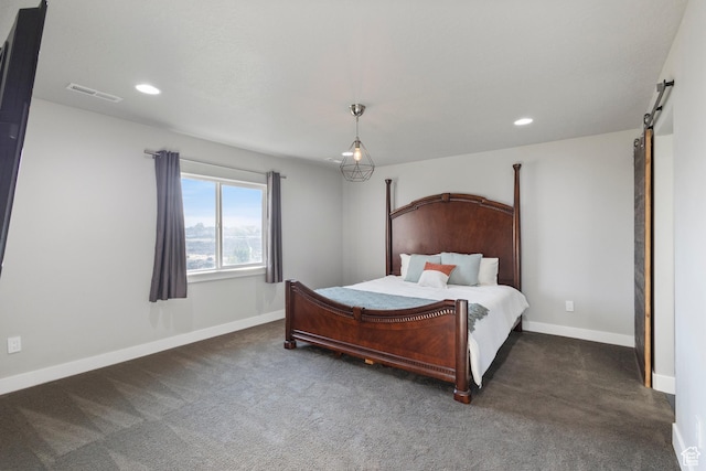 7672 N Evans Ranch Dr E, Eagle Mountain, UT 84005 - bedroom with a barn door, recessed lighting, and dark carpet