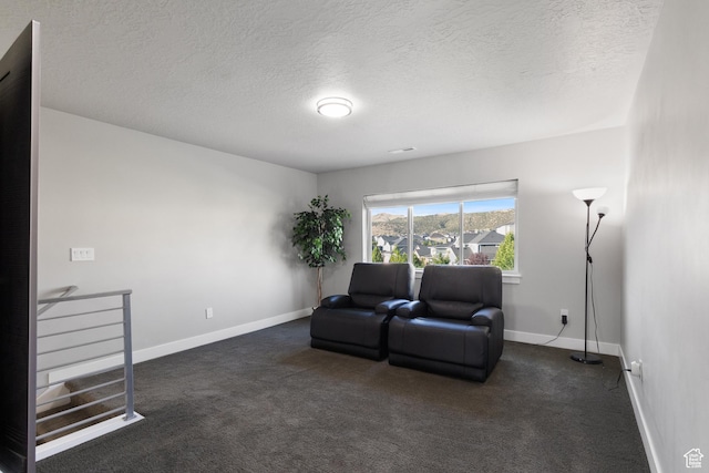 7672 N Evans Ranch Dr E, Eagle Mountain, UT 84005 - sitting room featuring a textured ceiling and dark carpet