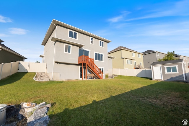 7672 N Evans Ranch Dr E, Eagle Mountain, UT 84005 - back of property featuring a fenced backyard, a storage shed, stairway, stucco siding, and a residential view