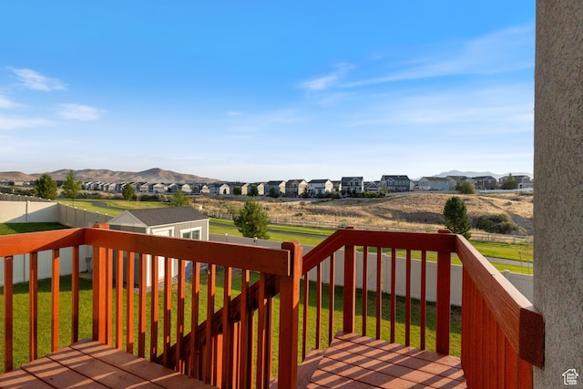 7672 N Evans Ranch Dr E, Eagle Mountain, UT 84005 - wooden deck featuring an outbuilding, a residential view, and a mountain view