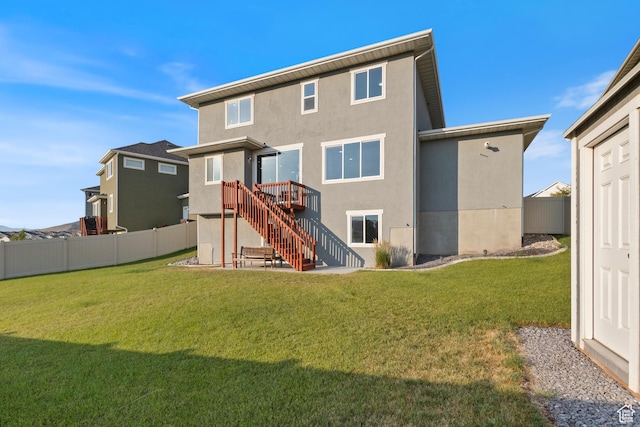 7672 N Evans Ranch Dr E, Eagle Mountain, UT 84005 - back of property featuring stucco siding and stairway