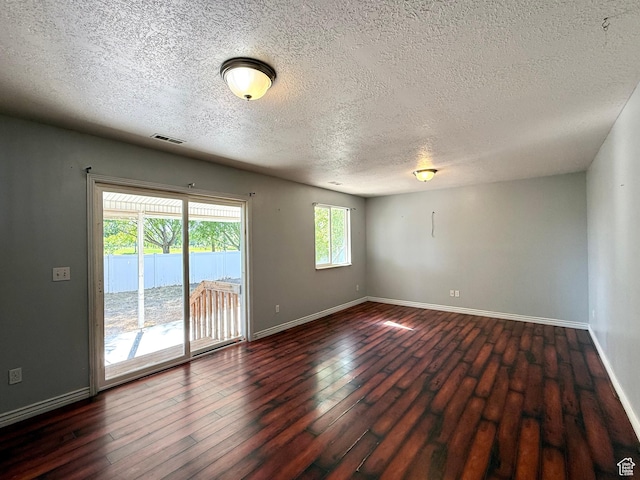 2573 W Remuda Dr, Farr West, UT 84404 - spare room with a textured ceiling and dark wood finished floors