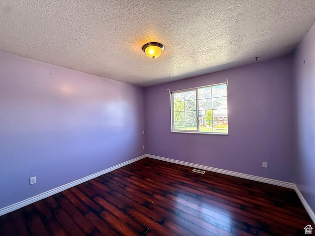 2573 W Remuda Dr, Farr West, UT 84404 - unfurnished room with hardwood / wood-style flooring and a textured ceiling