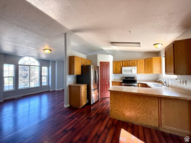 2573 W Remuda Dr, Farr West, UT 84404 - kitchen with stainless steel appliances, a textured ceiling, open floor plan, a peninsula, and light countertops
